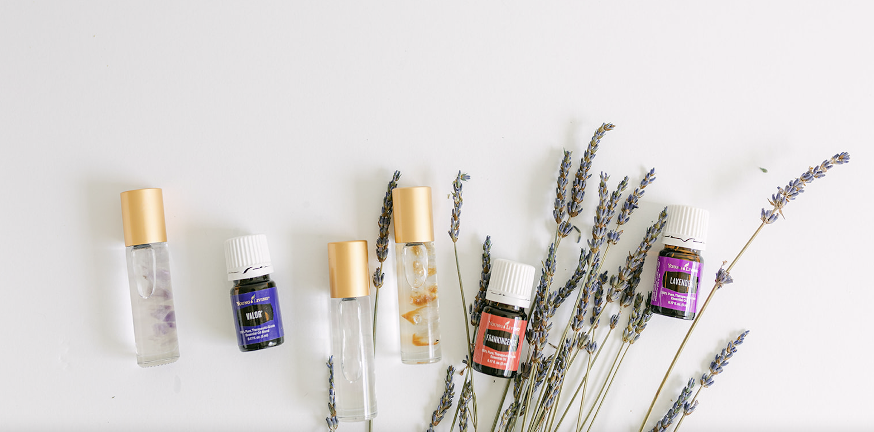 Collection of Essential Oils and bottles surrounded with lavender